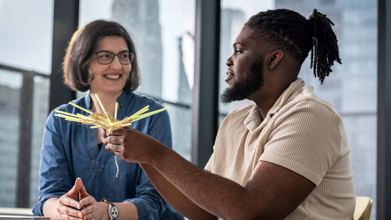 Computer Science Professor Andreea Cotoranu with a student.