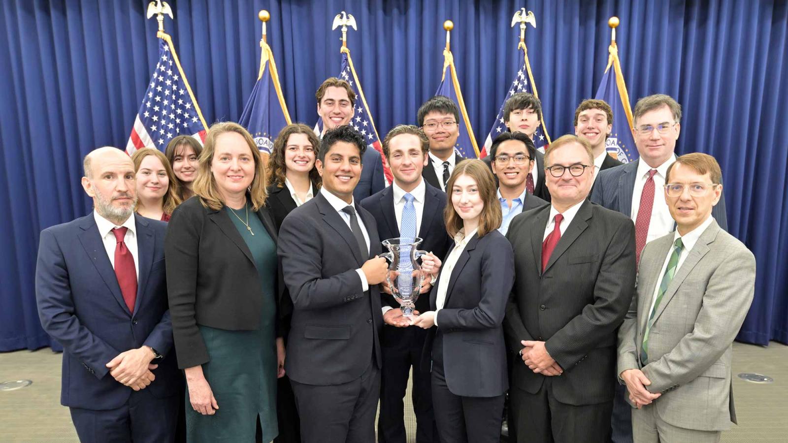 Pace University Fed Challenge Team holding trophy after winning sixth title