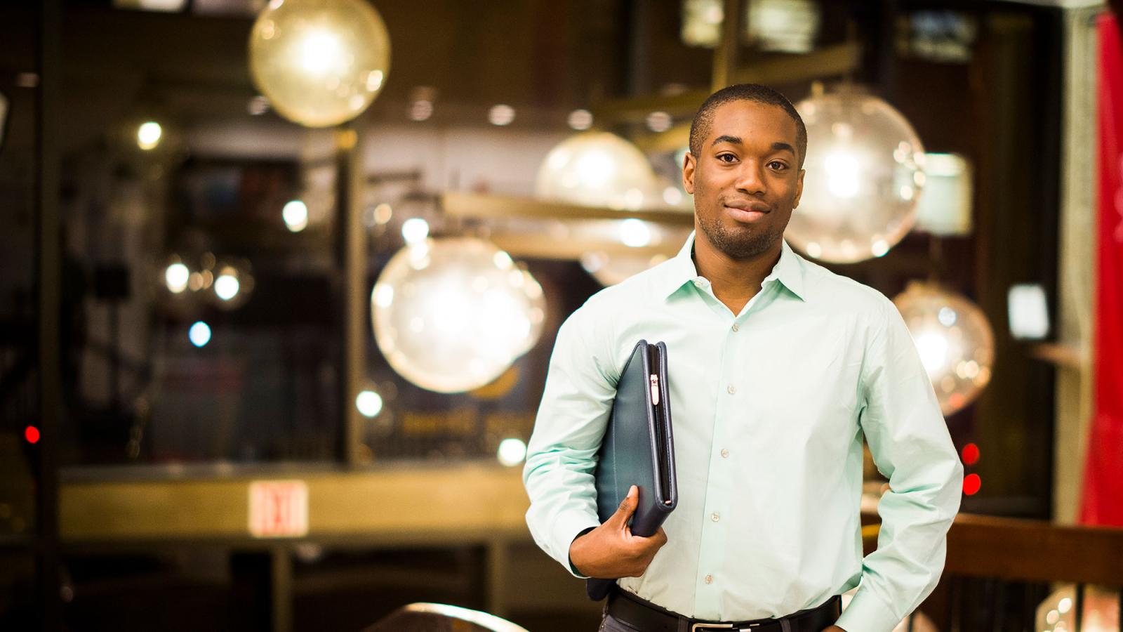 Pace University student in a business attire, smiling at the camera.