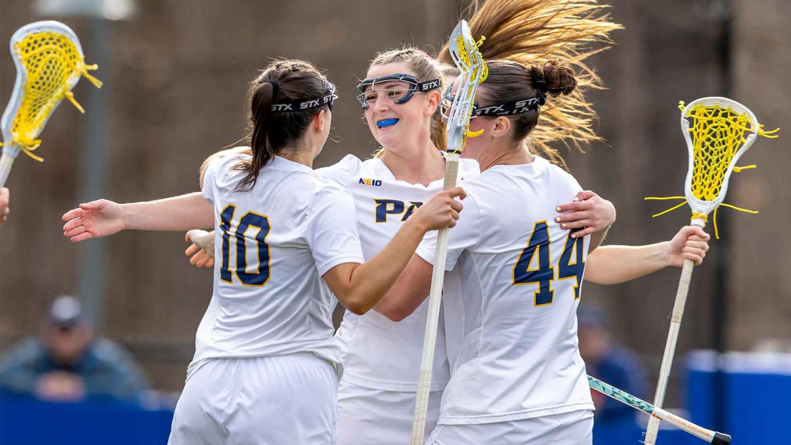 Pace University women's lacrosse athletes celebrate a win