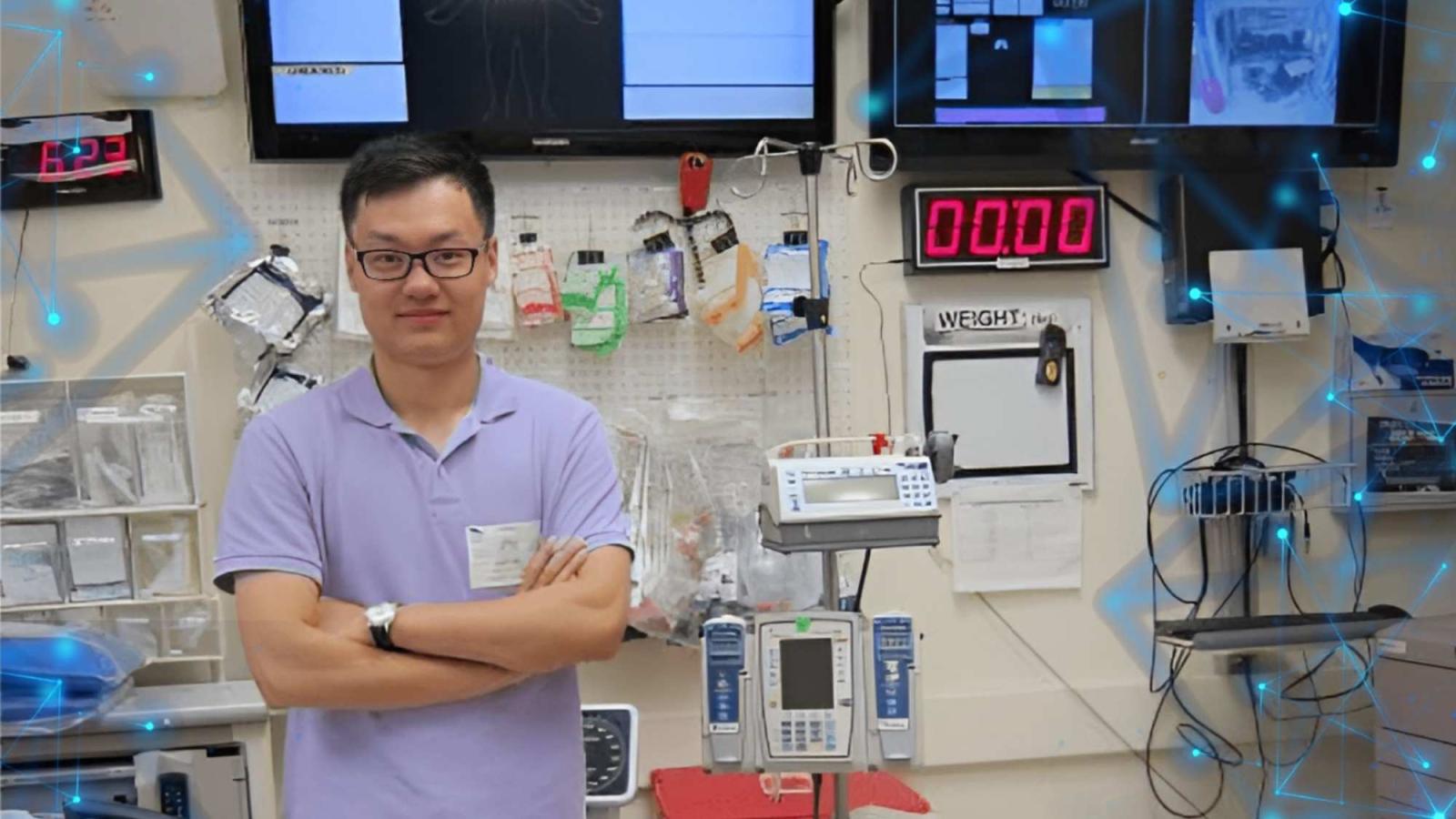 Seidenberg professor Zhan Zhang posing in front of medical equipment