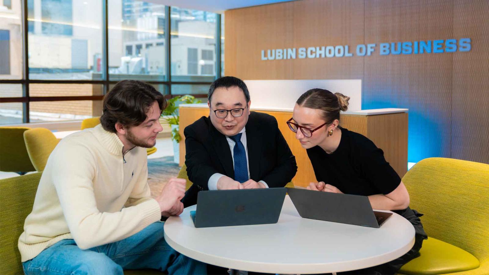 Students and professor sitting in a Lubin lounge.