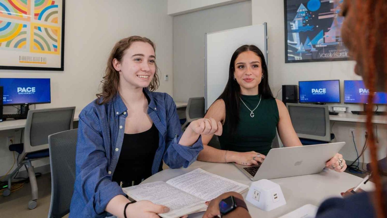 Mentor helping a students with academic skills