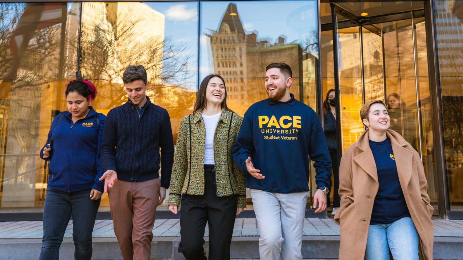 Group of graduate Pace University students leaving 1 Pace Plaza in NYC.