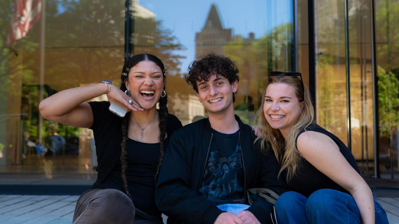 Group of Pace University students smiling at the camera.