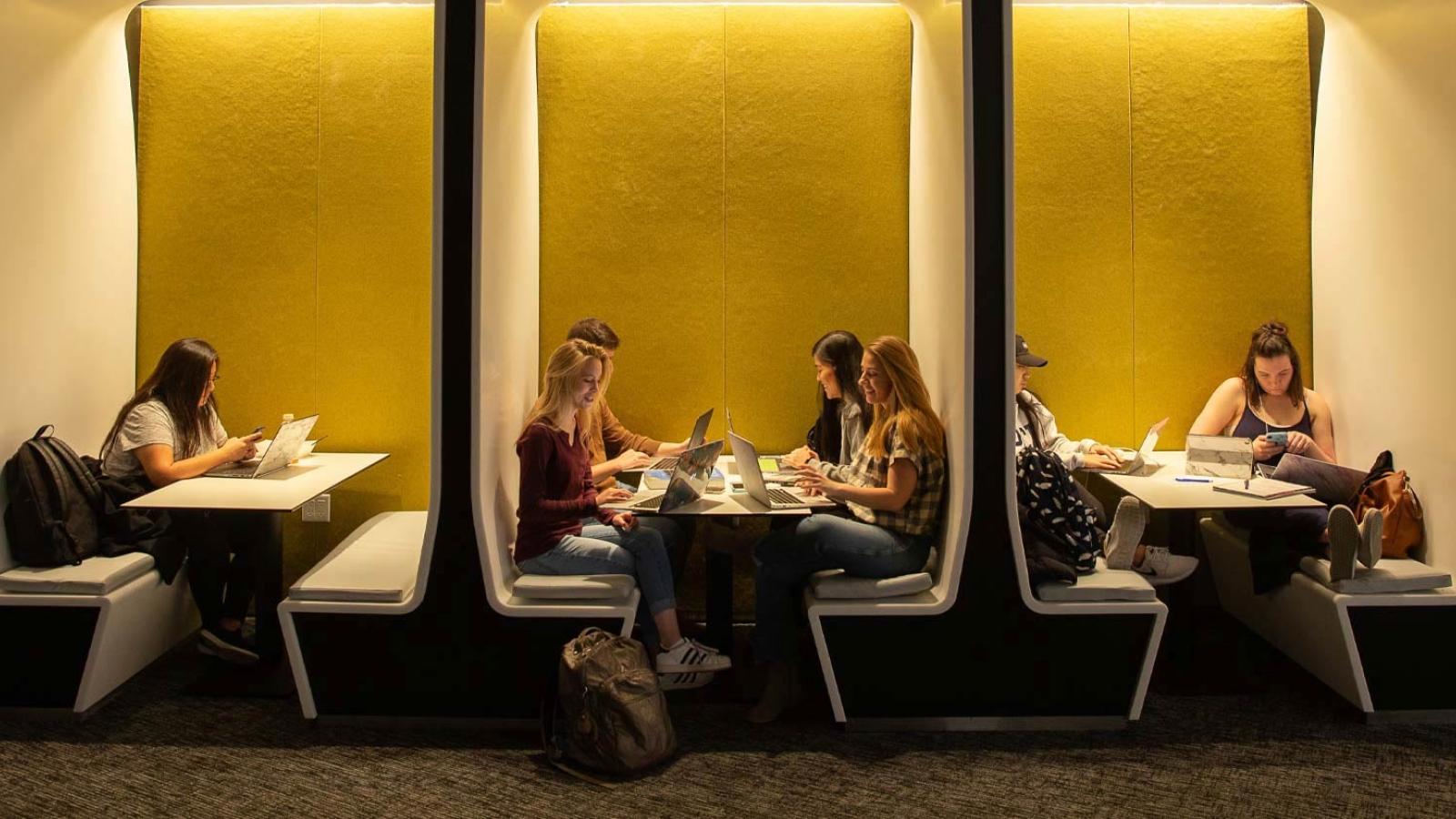 Student sitting at the study tables of One Pace Plaza