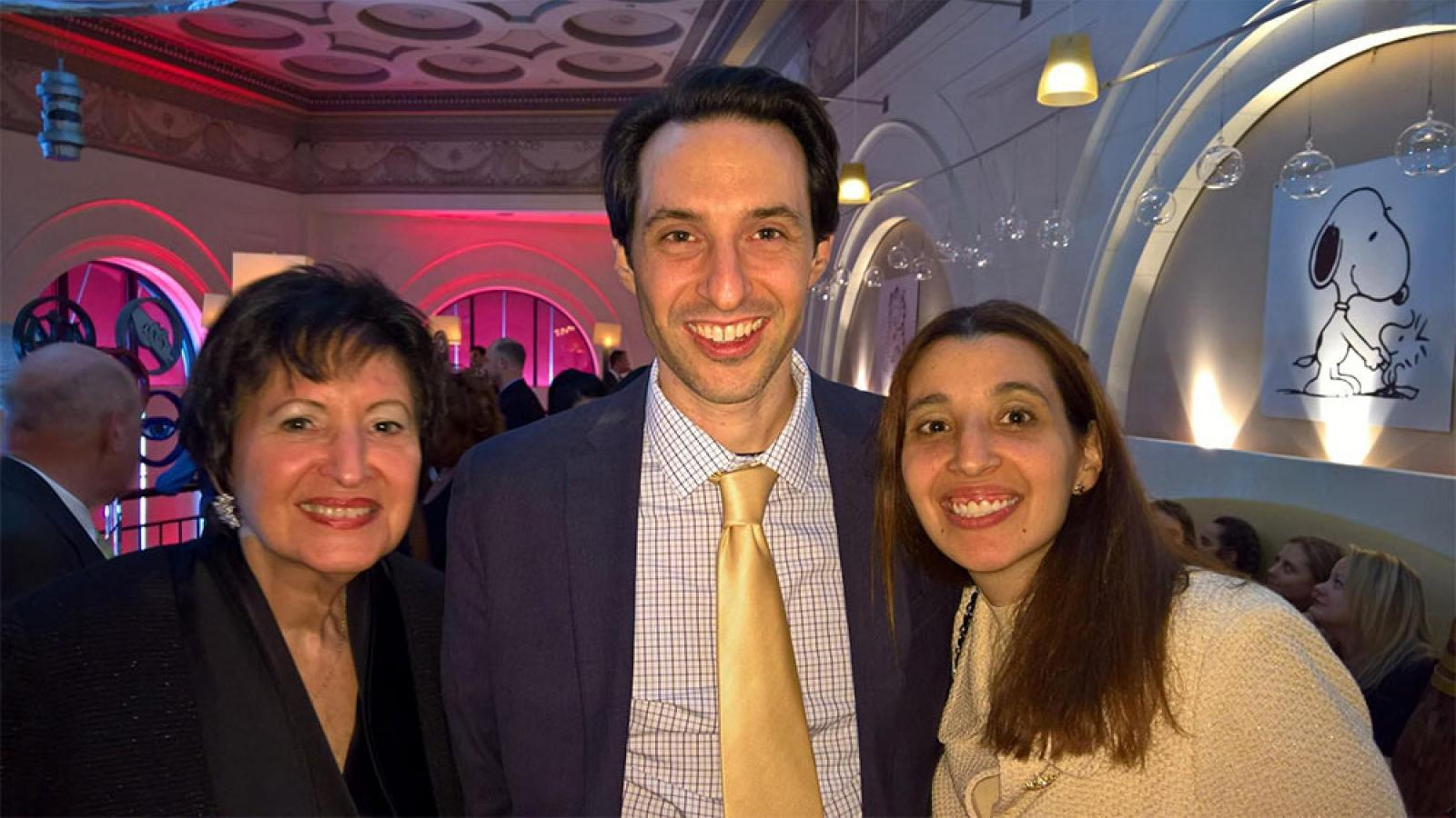 photo of an older man, a woman, and a young woman