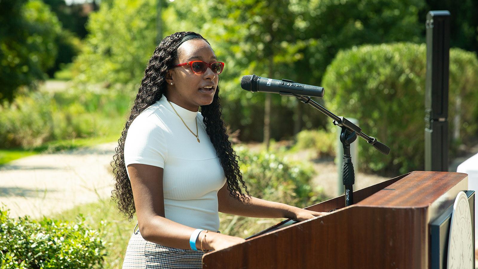 kimberly mars at a podium