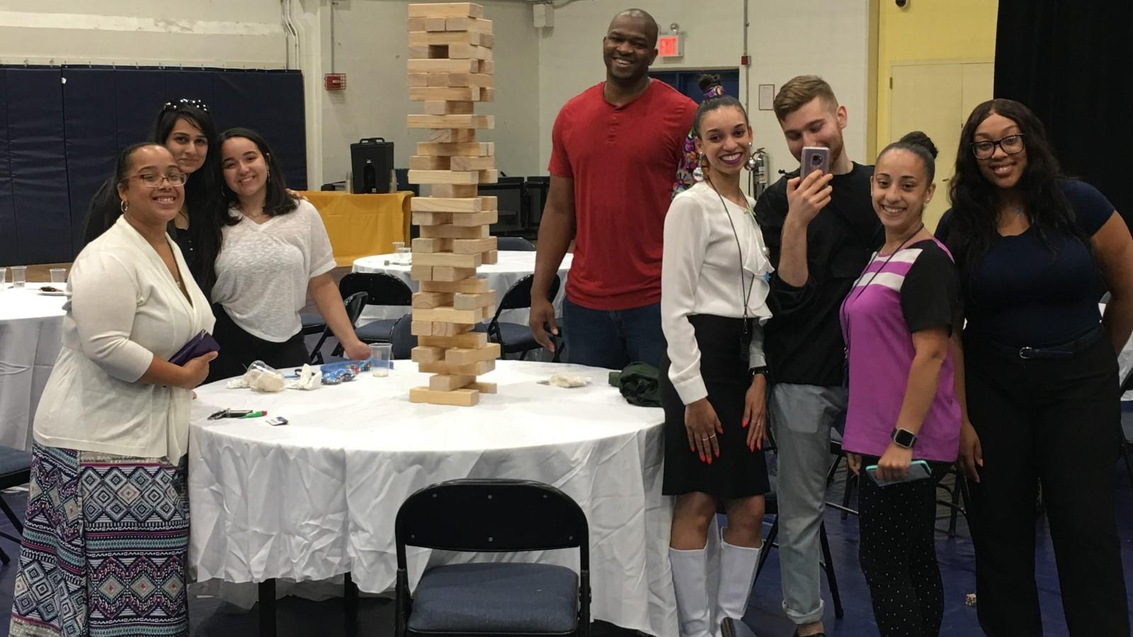 University staff members enjoying a game of giant Jenga at the Administrative Staff Council annual picnic in 2018.