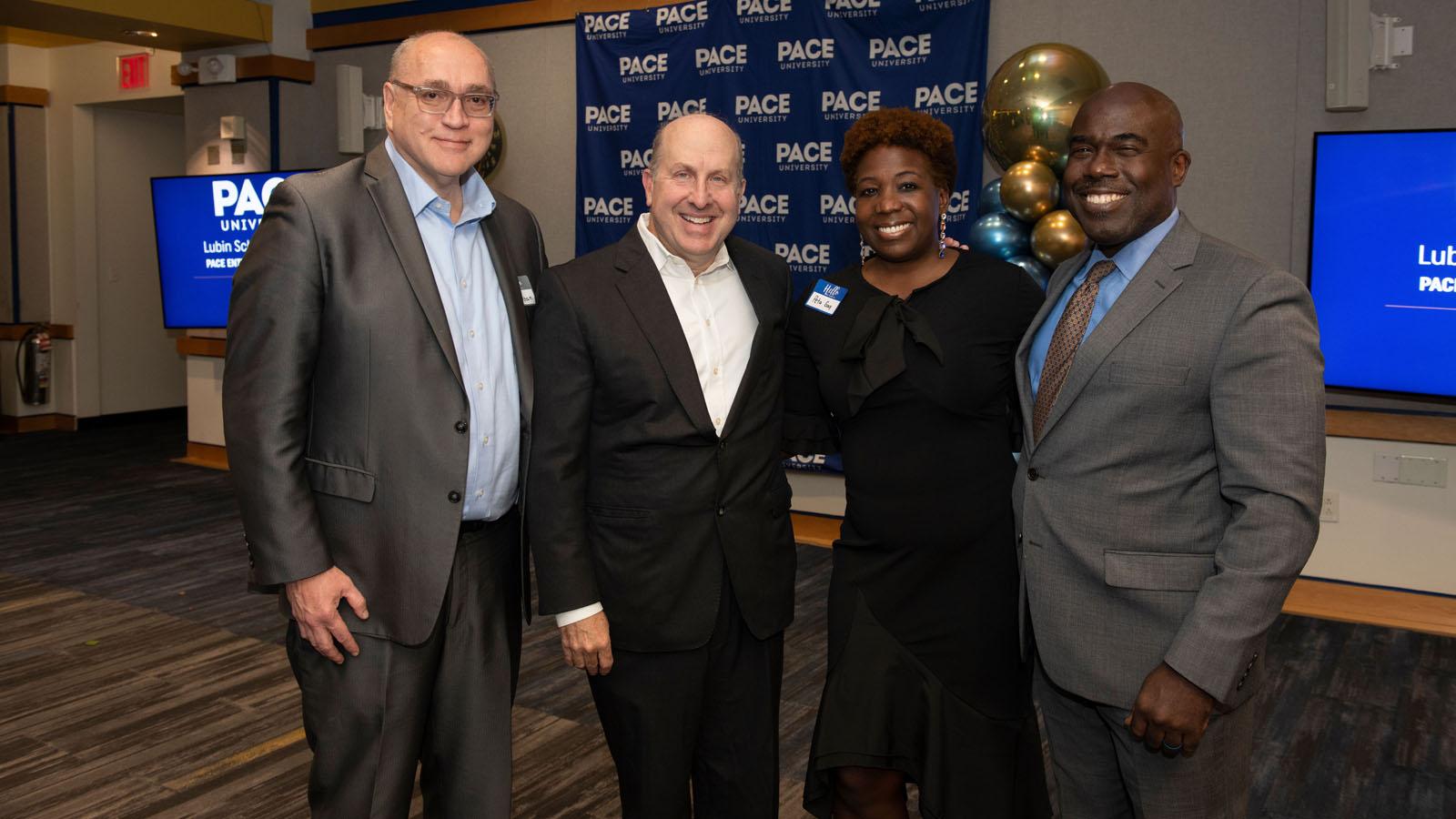 Dean Jonathan Hill (Seidenberg), Pace President Marvin Krislov, Peta-Gay Clark (Pace Board of Trustees), and Dean Horace E. Anderson, Jr. (Haub Law School) pose for a picture.