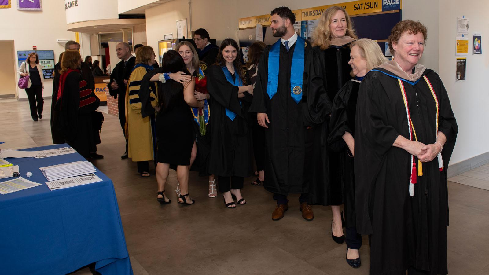 Deans, faculty, and staff lining up for the procession at the 2023 Lubin Pleasantville Awards Ceremony