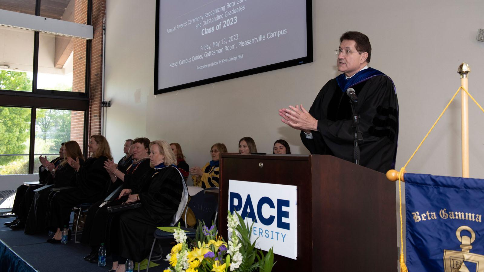 Lubin's Dean Lawrence G. Singleton leads a round of applause at the 2023 Lubin Pleasantville Awards Ceremony