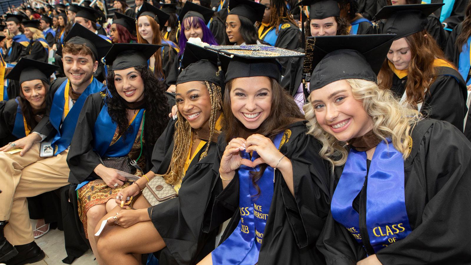 pace graduates posing for the camera