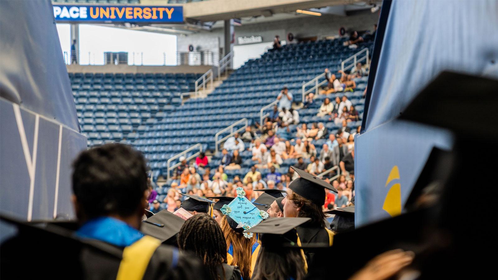 pace graduates walking out into the stadium