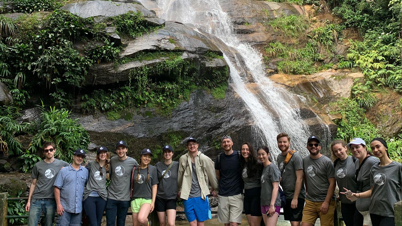 Group of Elisabeth Haub School of Law students in Brazil next to a waterfall