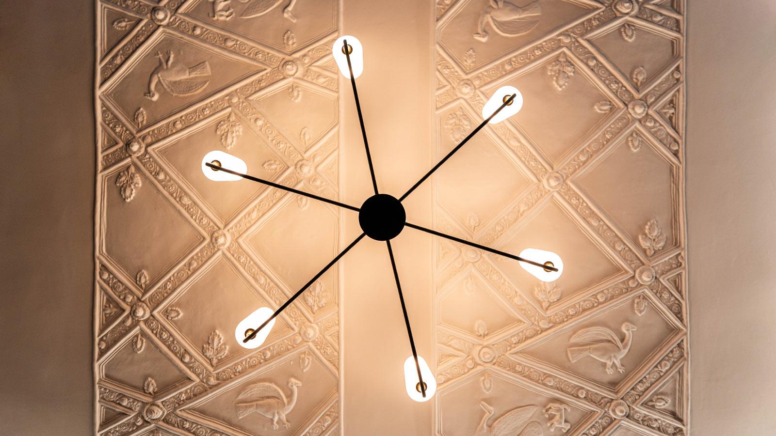 view of the ceiling and chandelier inside the Pace Study