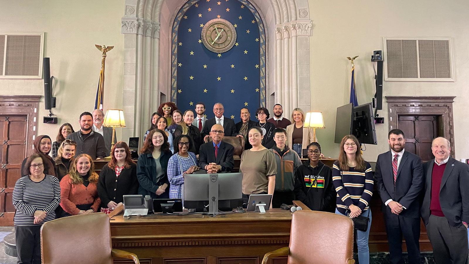 Group posing for the camera in the chambers of Judge Myron Thompson