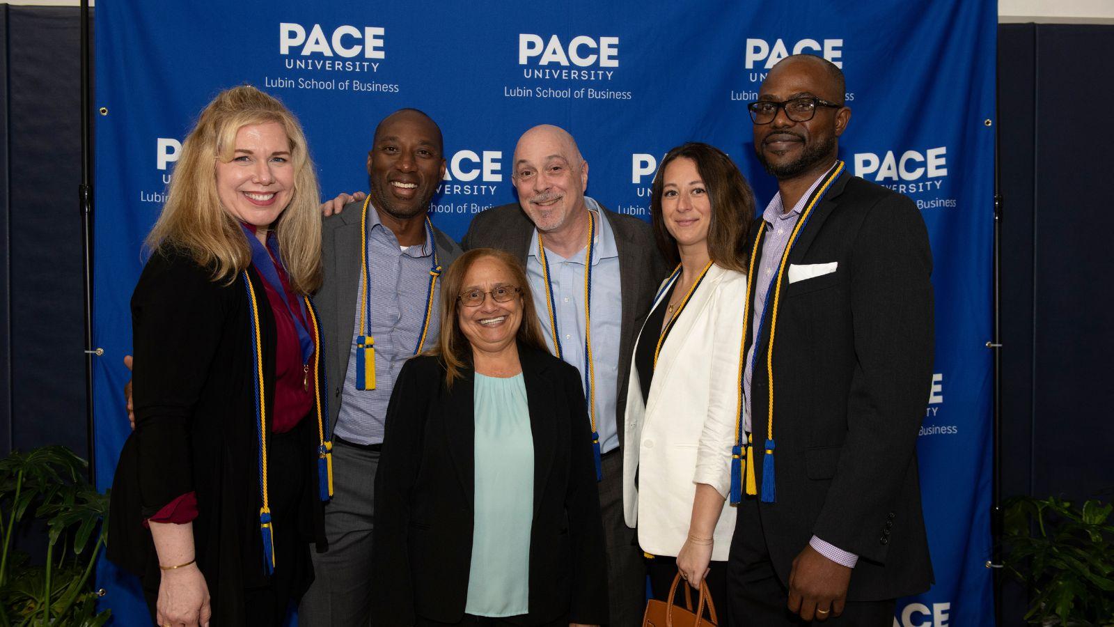 Doctoral award winners with Margaret Hanson (center), program coordinator, Doctoral Program in Business (DPS).