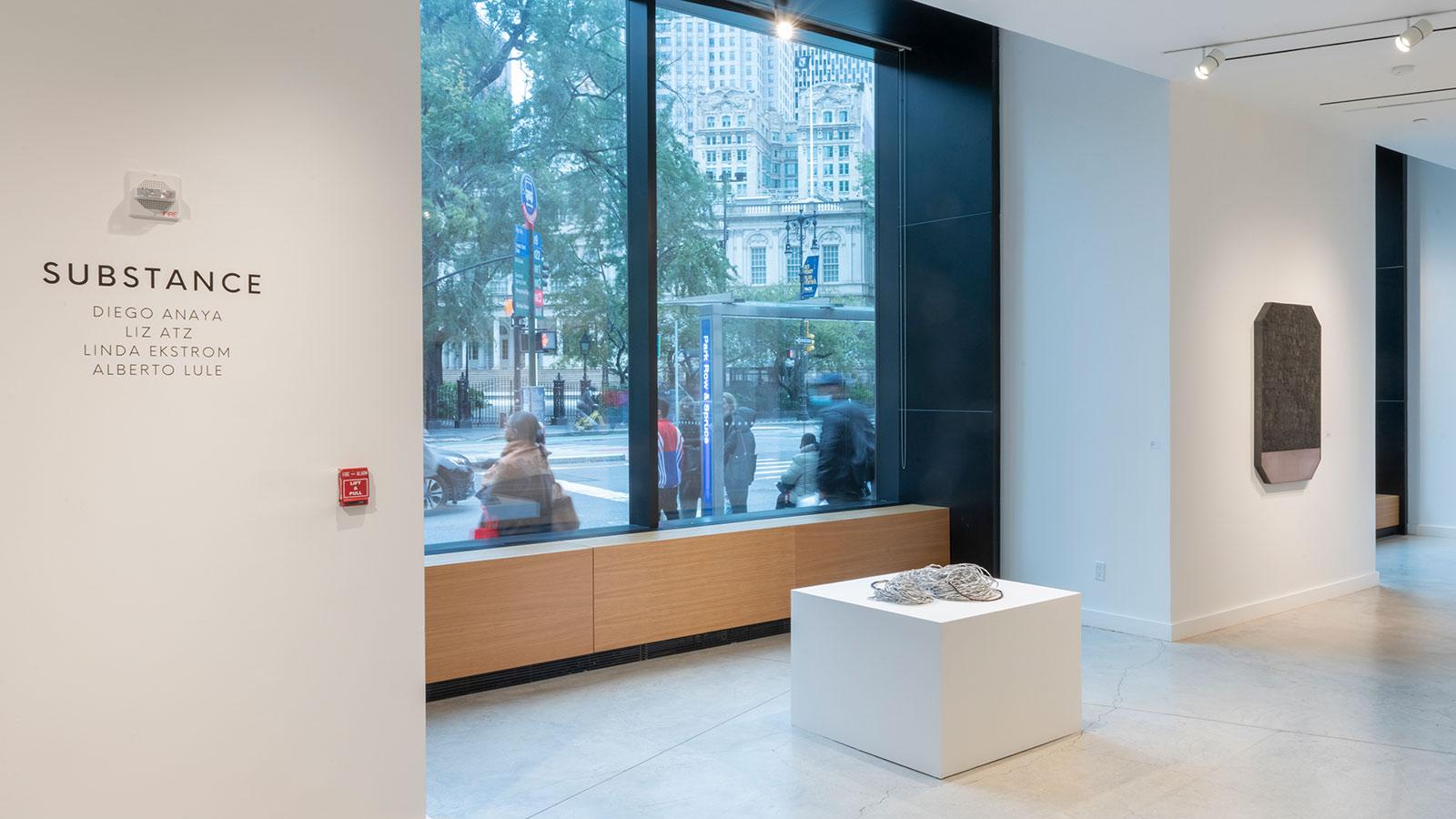 Artwork on display by various abstract artists in the "Substance" exhibition at the Pace University Art Gallery.