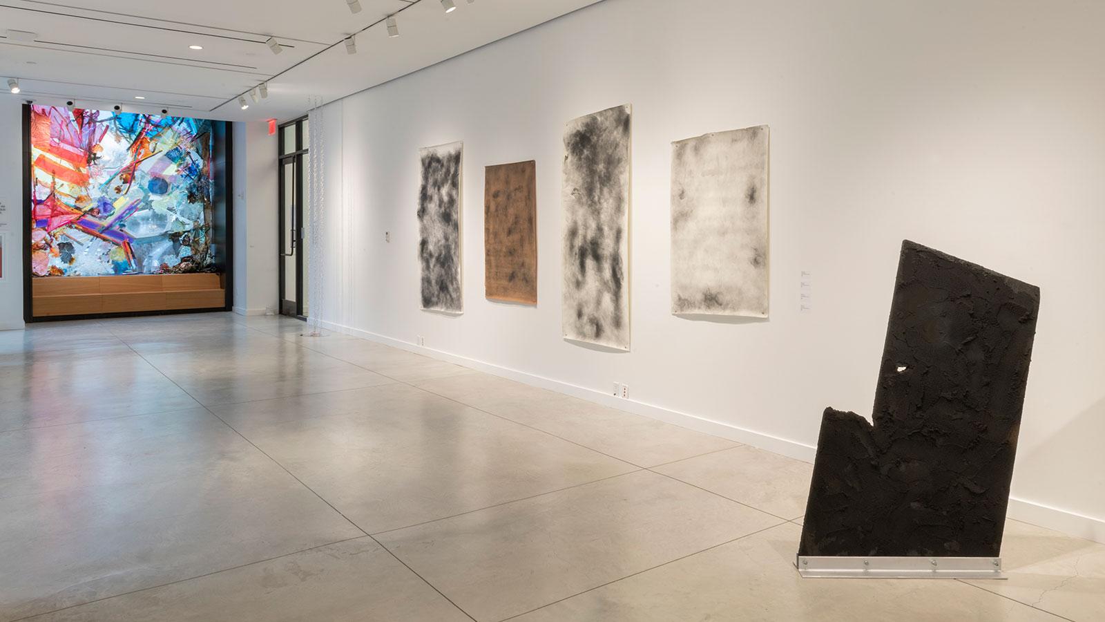 Artwork on display by various abstract artists in the "Substance" exhibition at the Pace University Art Gallery.