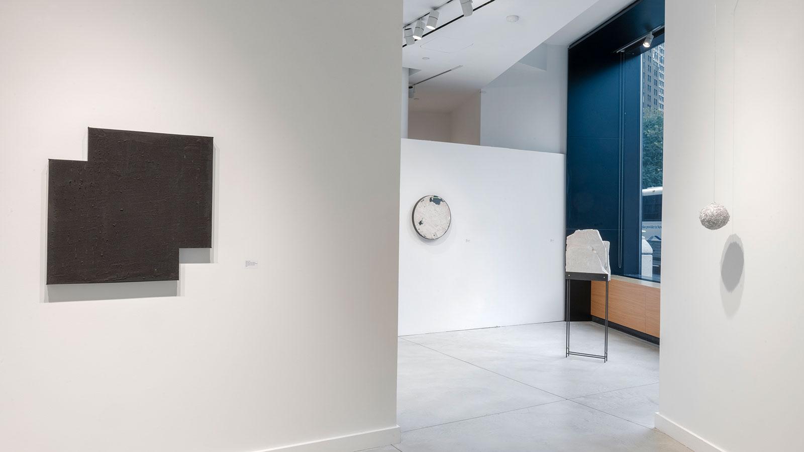 Artwork on display by various abstract artists in the "Substance" exhibition at the Pace University Art Gallery.