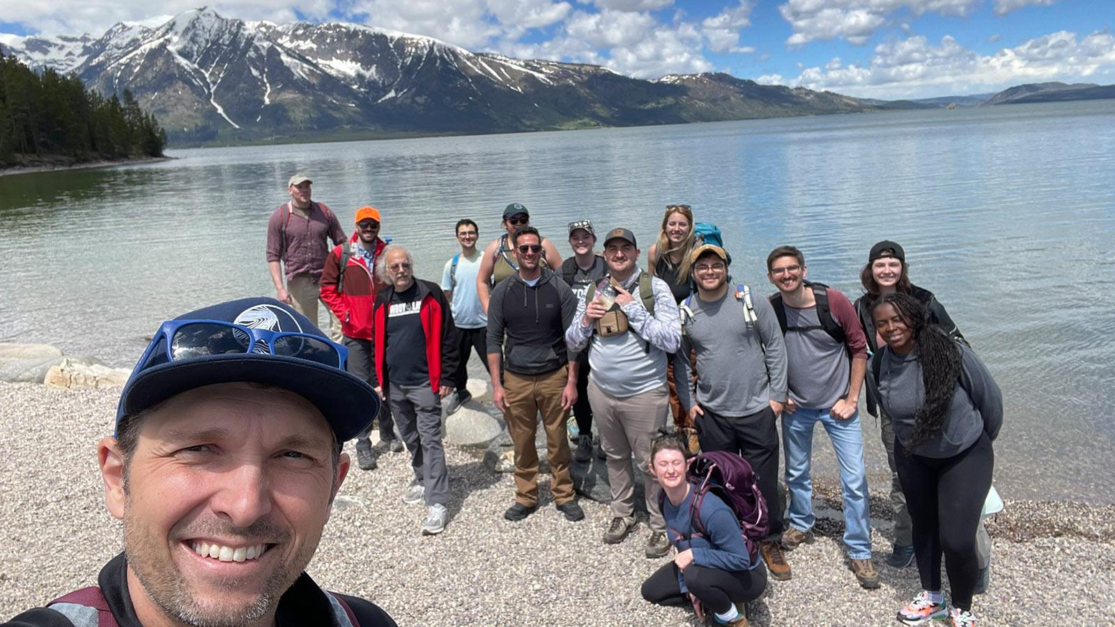 Elisabeth Haub School of Law professor and students taking a group selfie on the beach