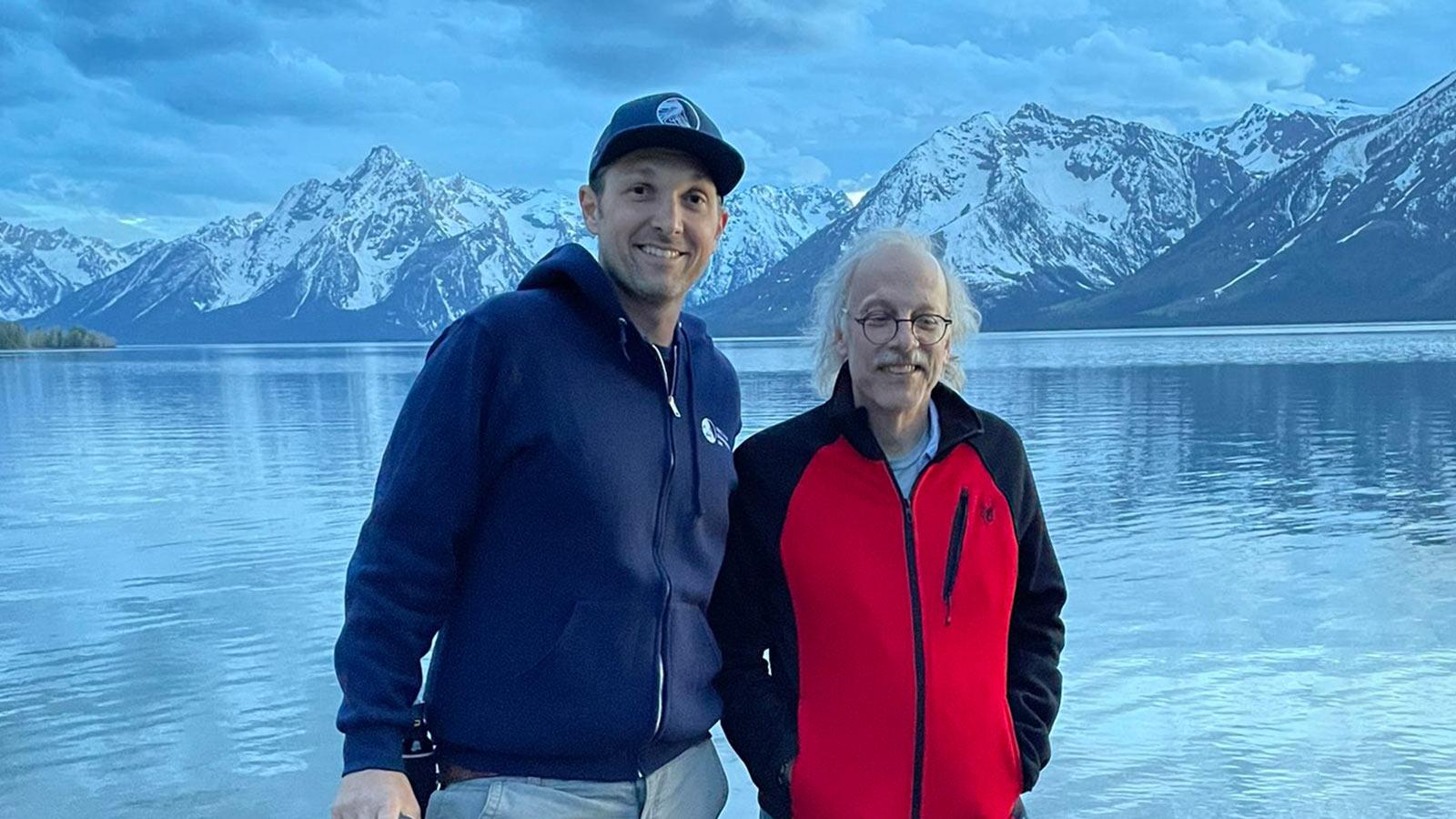 Two Elisabeth Haub School of Law Professors in front of a lake with mountain scenery