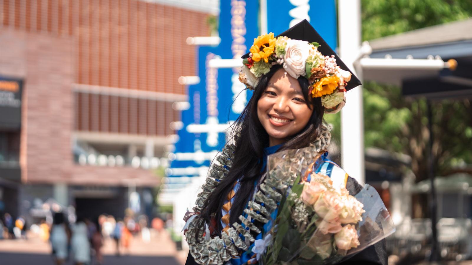 Pace grad posing at Commencement. 