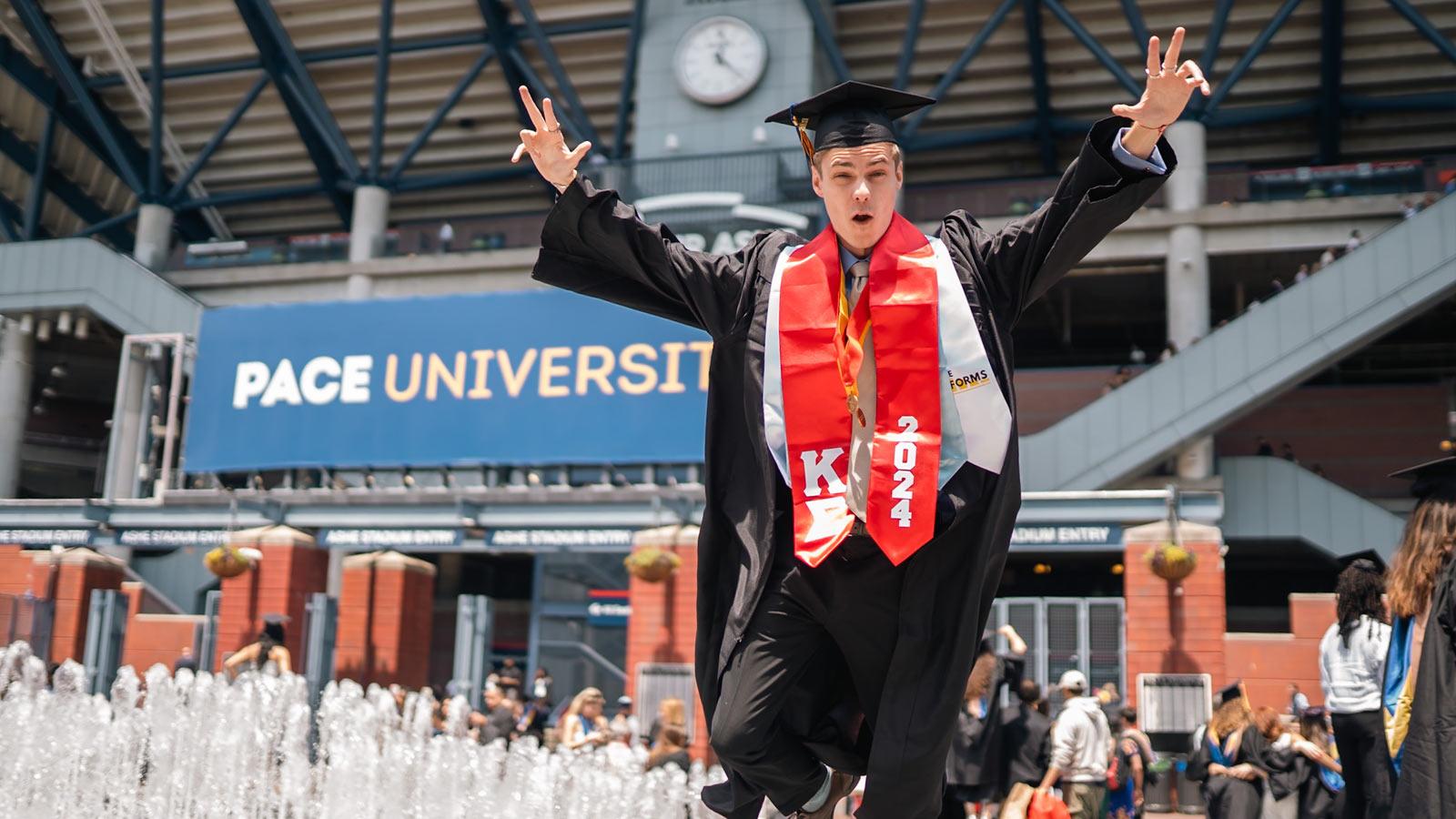 Pace grad posing at Commencement. 
