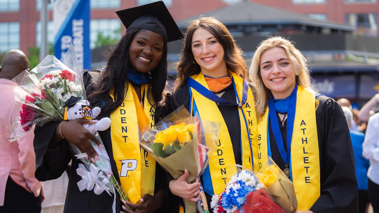 Pace grad posing at Commencement. 