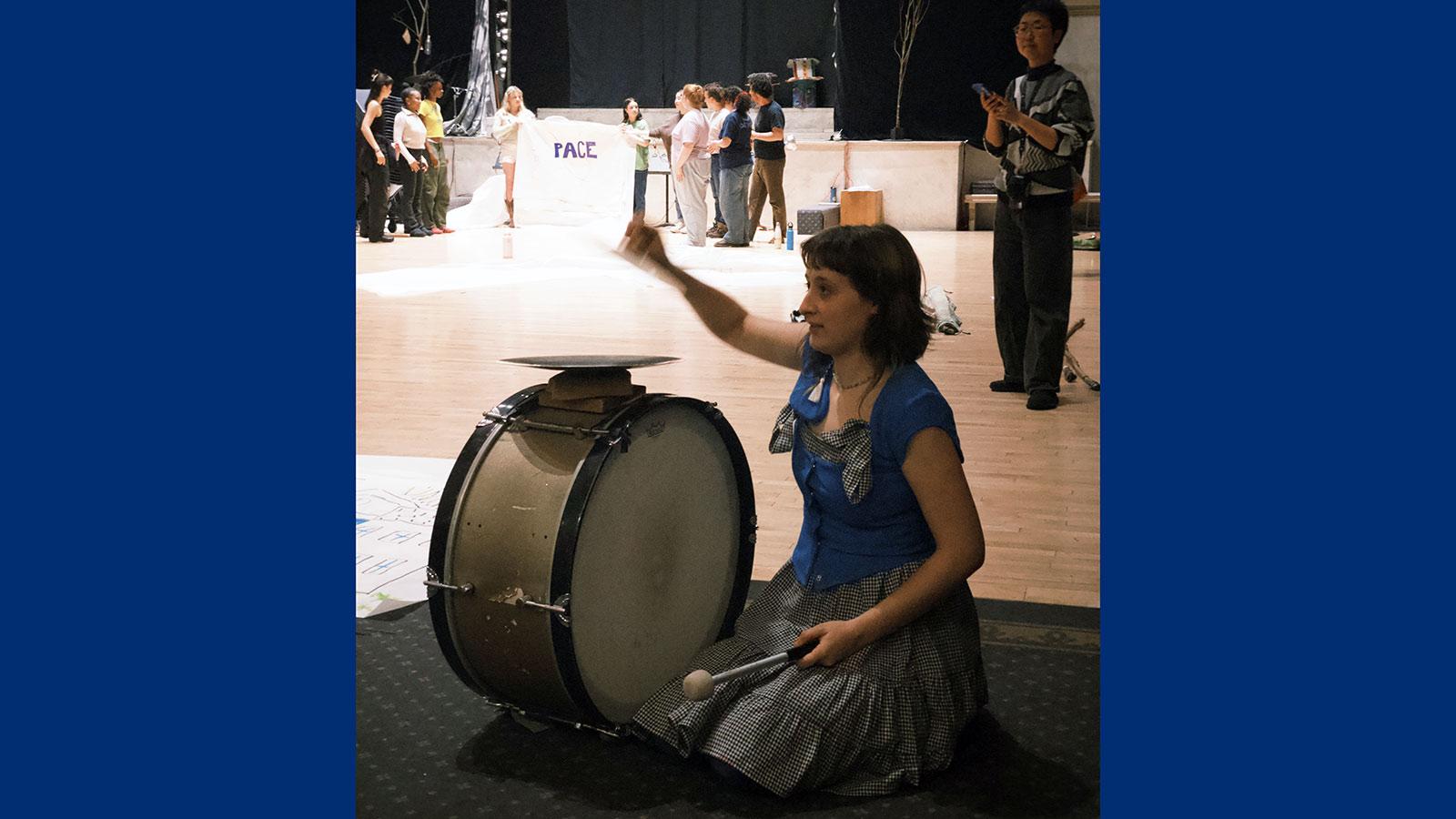 Pace University's Peace and Justice Studies and English students playing the drums and singing while working with the Bread and Puppet Theater to express social justice through art.