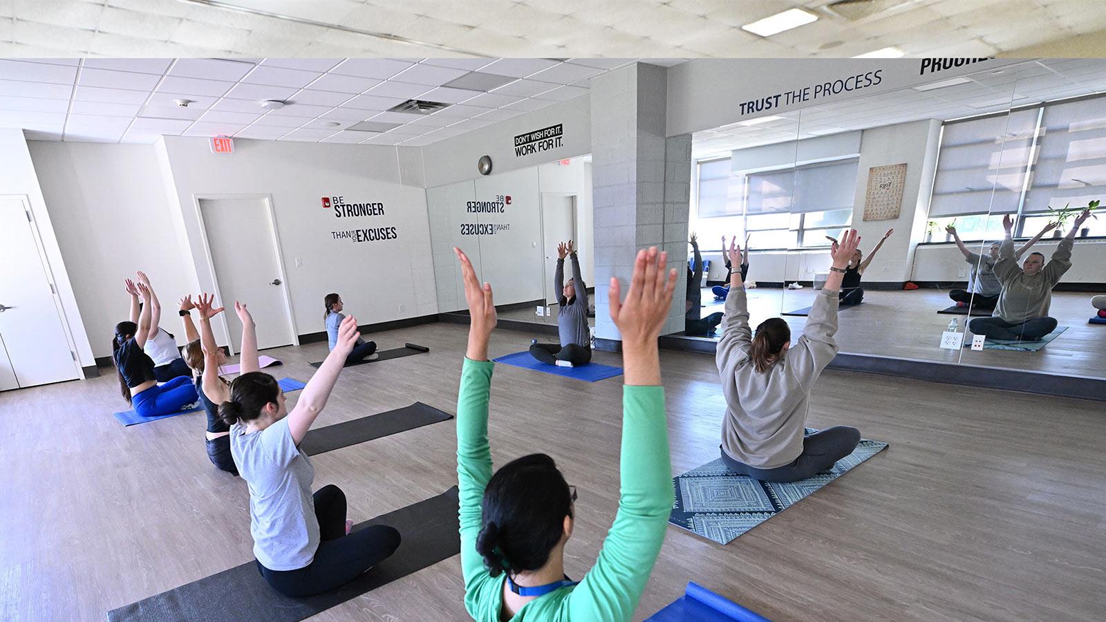 People doing yoga at the wellness center at Pace University