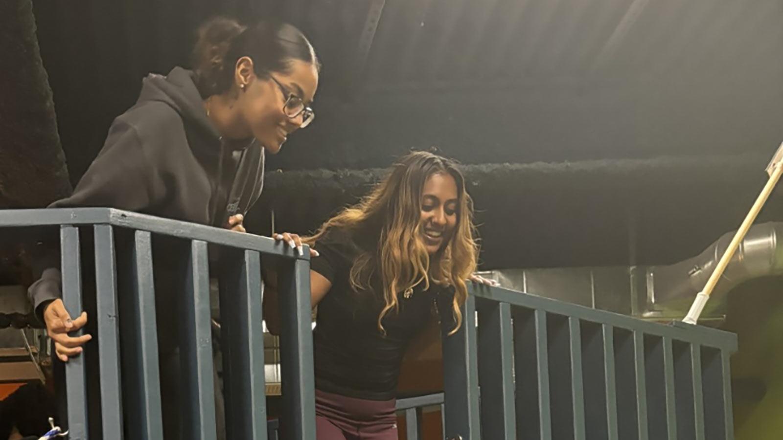 Two Pace University College of Health Profession students overlooking play area.