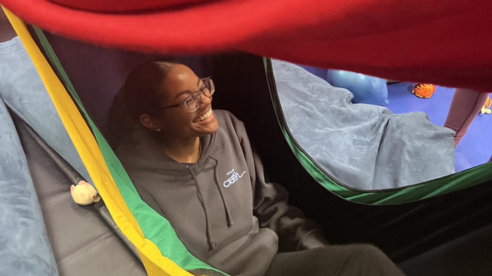 Pace University College of Health Professions student inside hammock.
