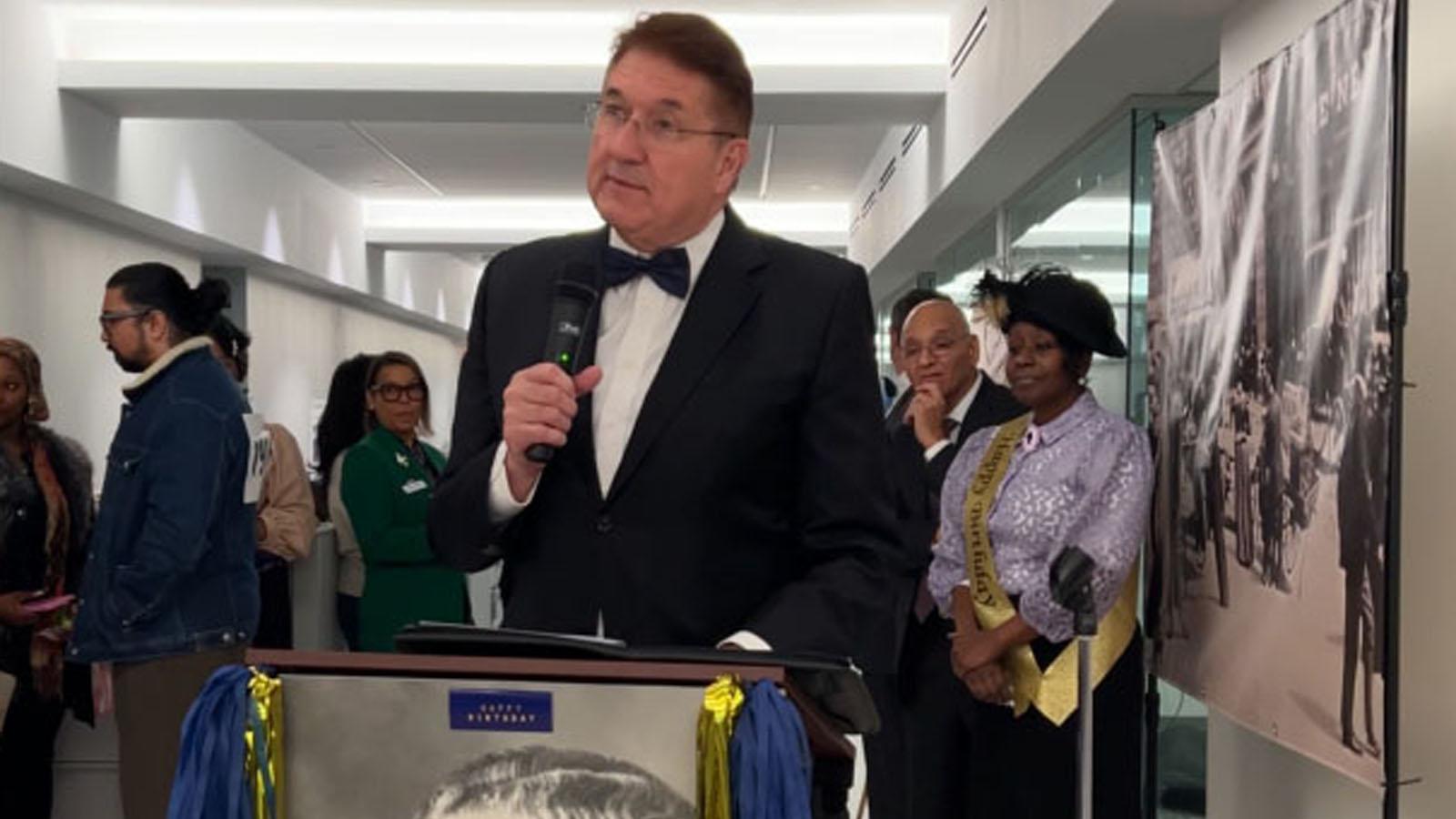 Dean Singleton at the podium giving a rousing speech honoring the school's founders, Charles and Homer Pace, and Joseph Lubin, on Founder's Day 2024. 