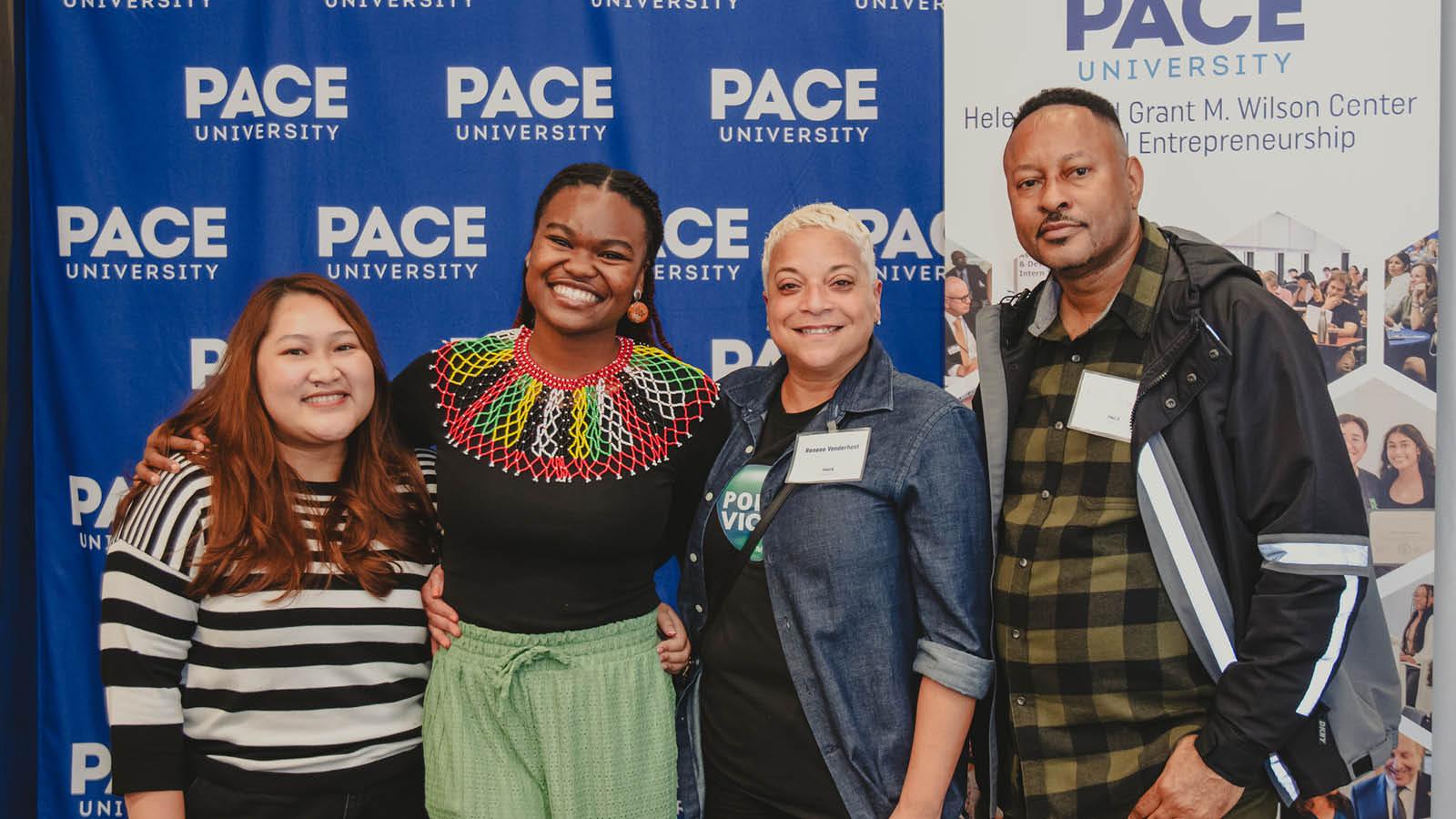 Wilson Center Intern and friends pose for photo at Annual Learning Outcomes