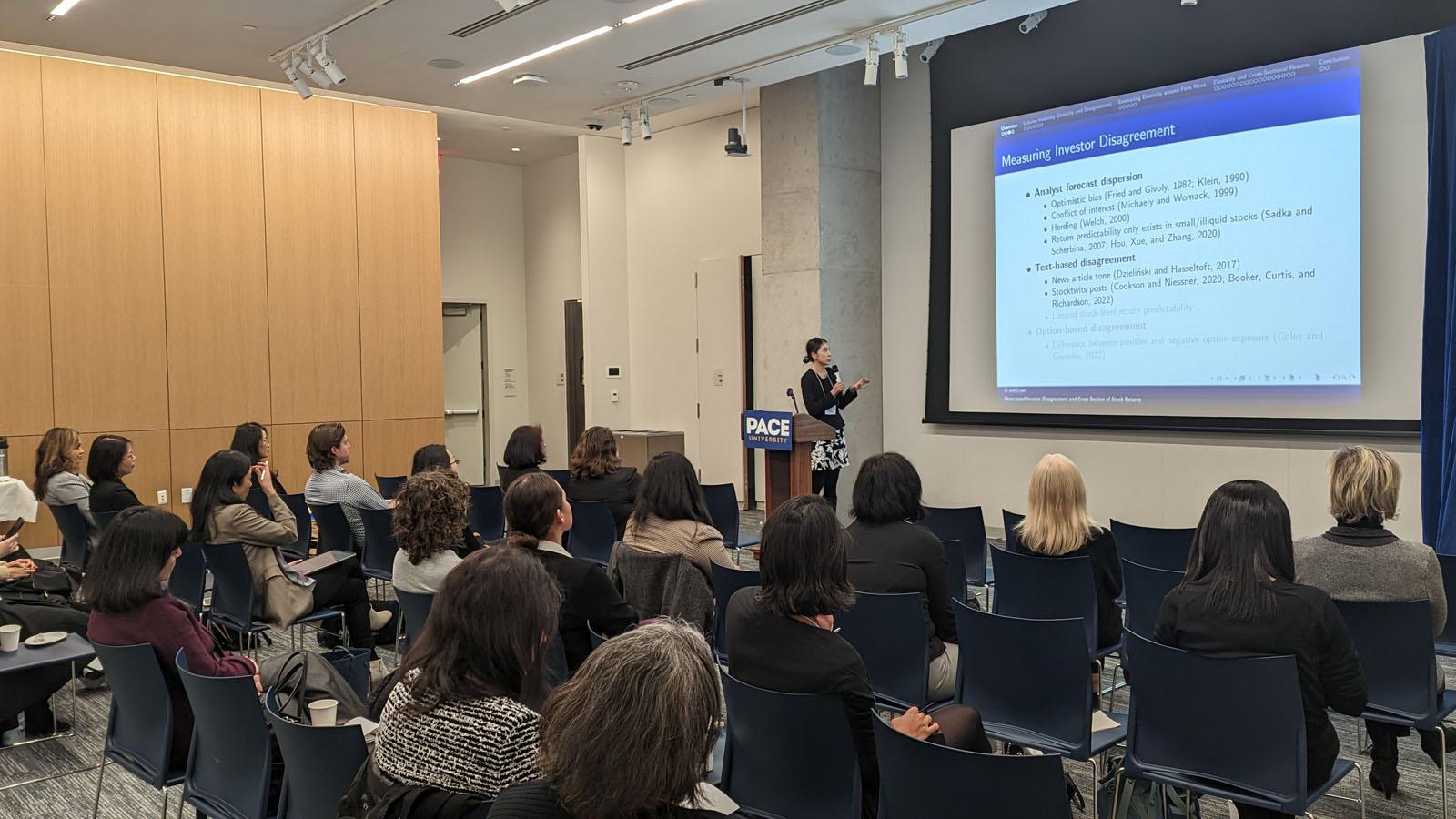 Professor Sophia Li of Rutgers University presenting her research in the main session at the 2023 Friends of Women in Finance Symposium-Greater New York (FWFS-GNY) at Pace University