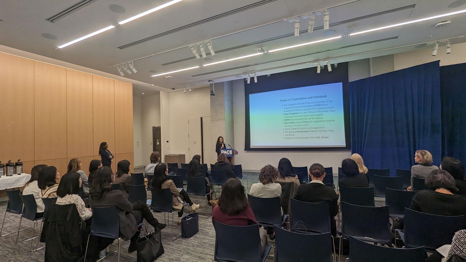 Professor Danling Jiang of Stony Brook University greets attendees at the 2023 Friends of Women in Finance Symposium-Greater New York (FWFS-GNY) at Pace University