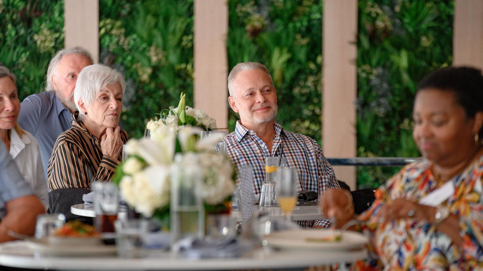 Pace alumni meeting for a regional programming brunch in Fort Lauderdale.