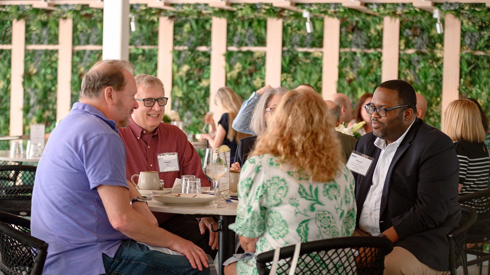 Pace alumni meeting for a regional programming brunch in Fort Lauderdale.