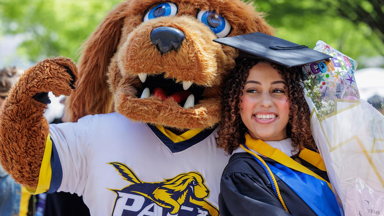 Graduate posing with T-Bone.