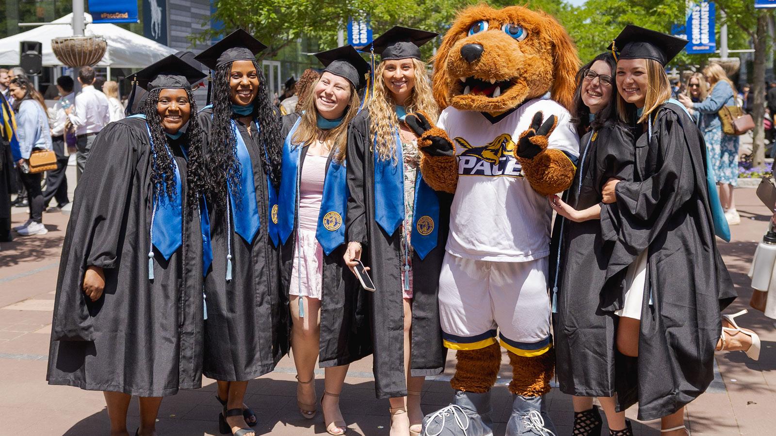 Graduates posing with T-Bone.