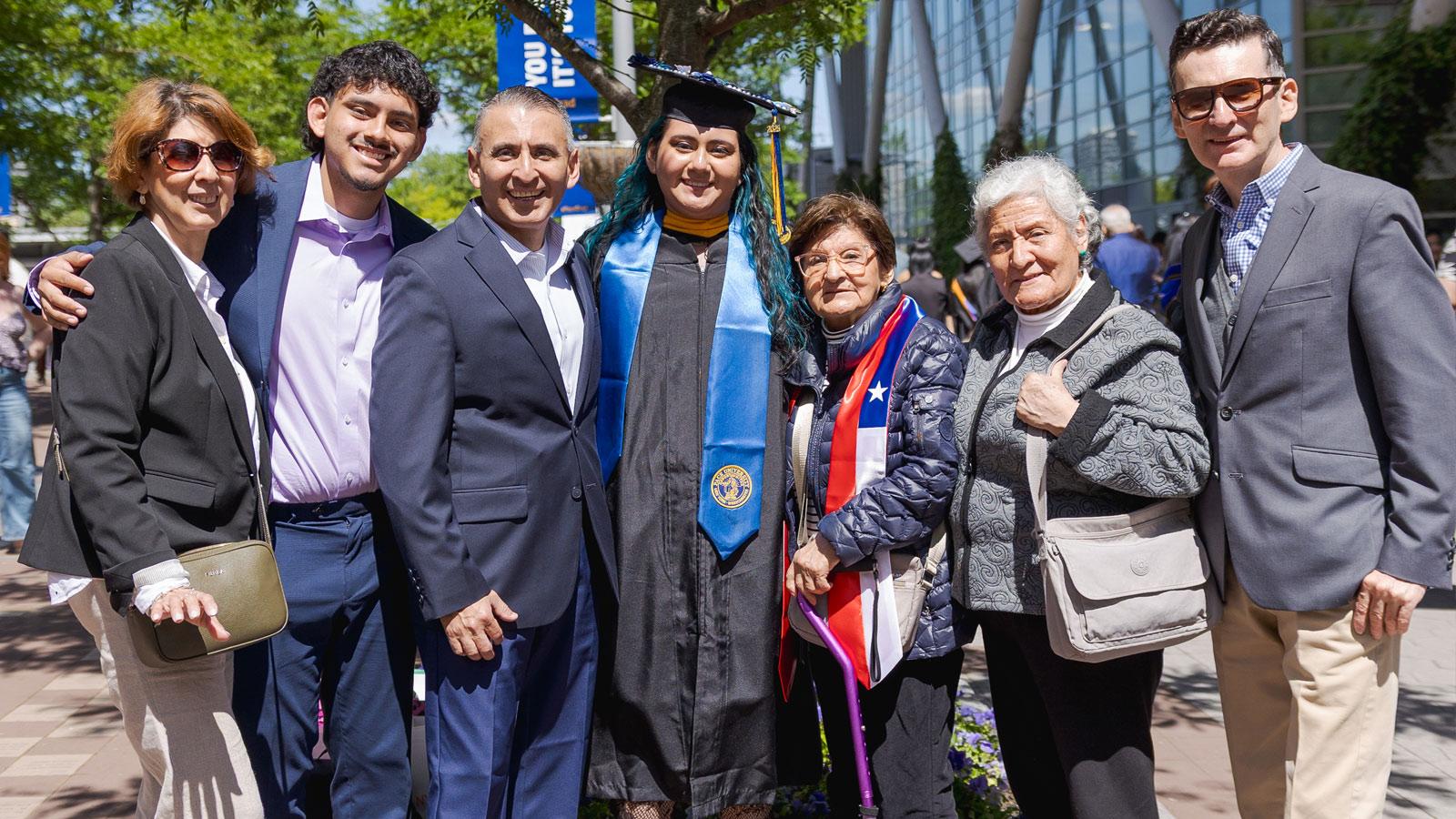 Graduate and family posing for the camera.