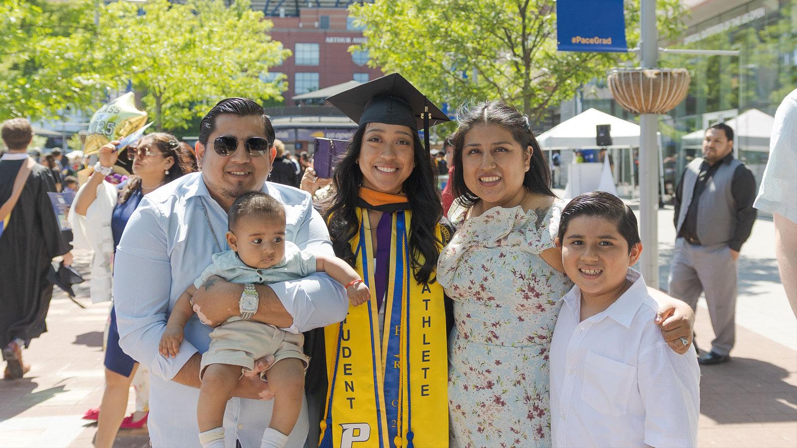 Graduate and family posing for the camera.