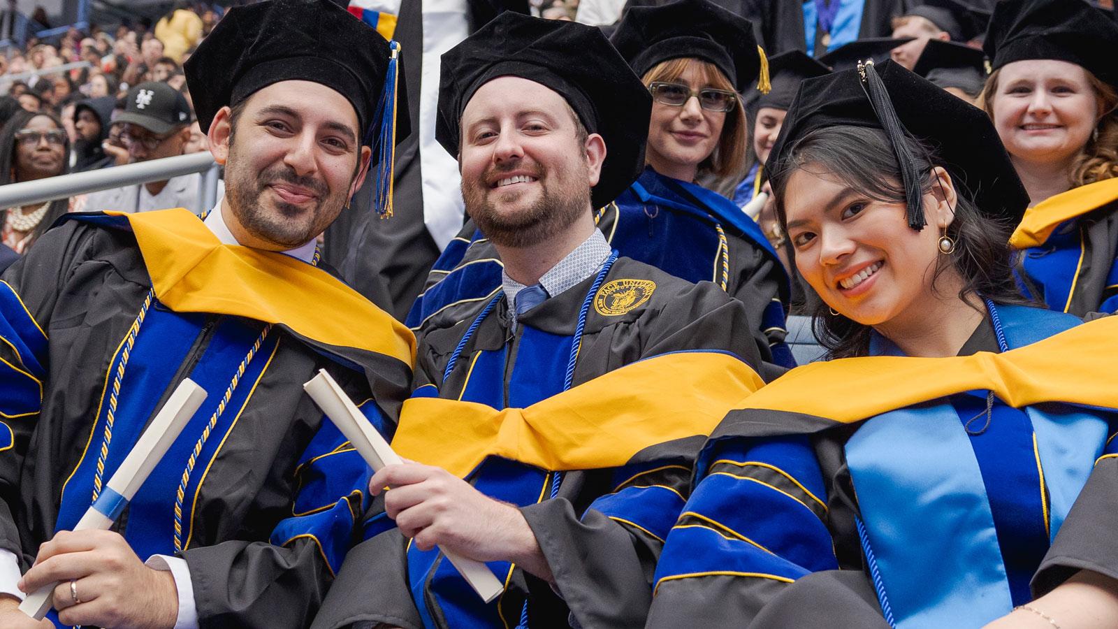 Graduates posing for the camera.