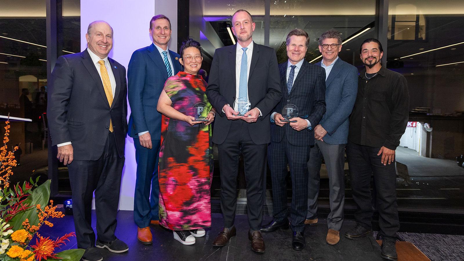 Group of Pace University Alumni and Pace President Marvin Krislov smiling at the camera at the 2025 Pace Celebrates: Changemakers event.