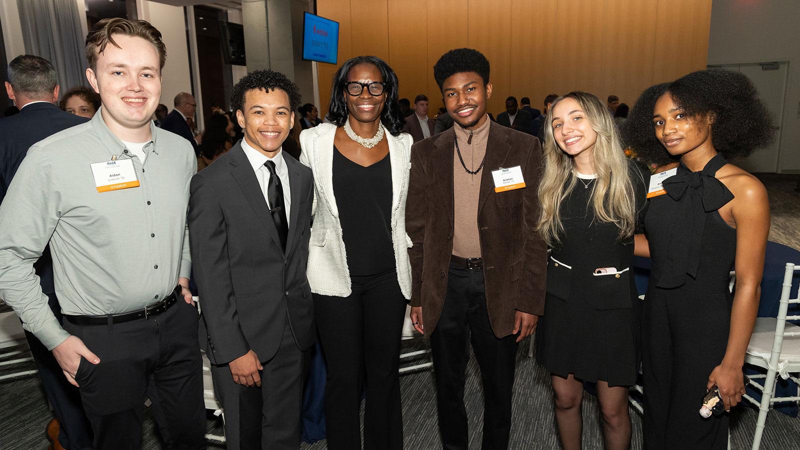 Group of Pace University students smiling at the camera at the Seidenberg Innovation Awards.