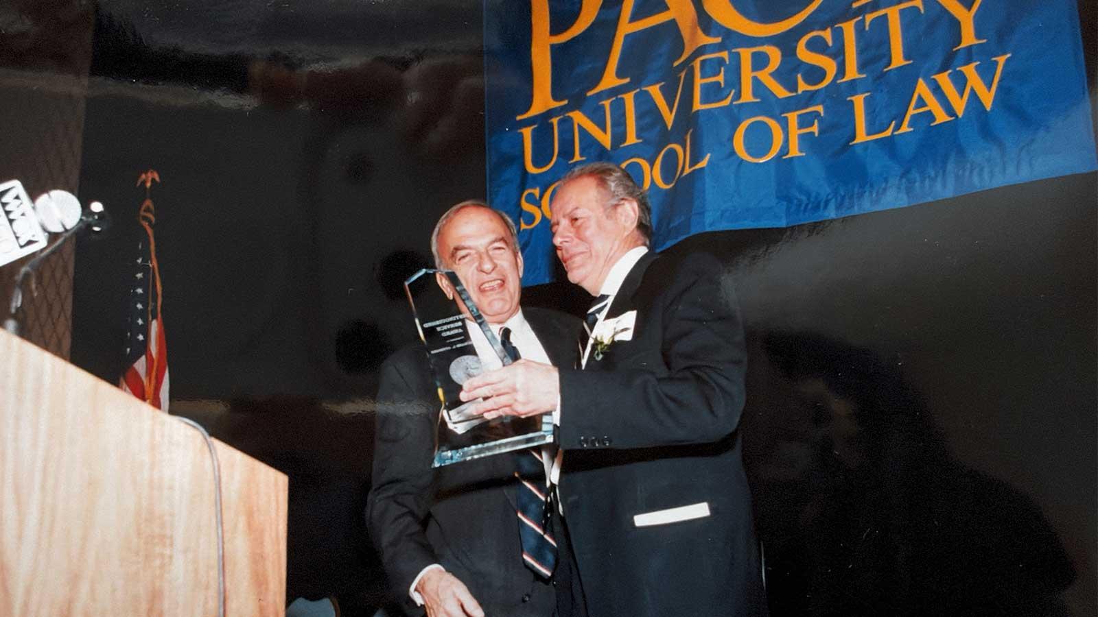 Dean Richard Ottinger winning an award at Elisabeth Haub School of Law