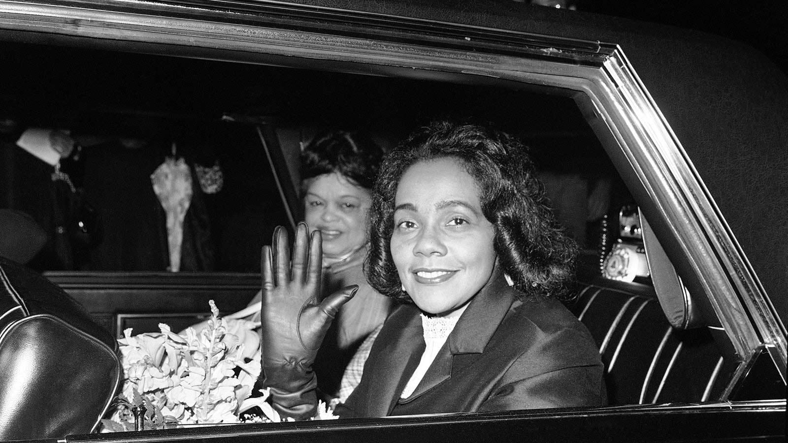 Coretta Scott King waves from an automobile after her arrival at Washington National Airport May 11, 1968.