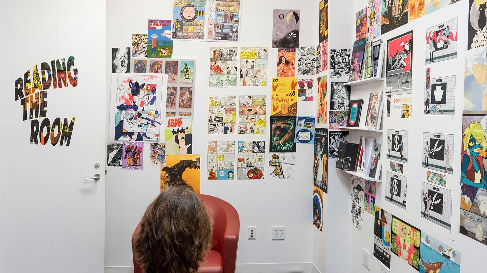 Artwork from various artists on display in the "Journey Illustrated" exhibition at the Pace University Art Gallery.